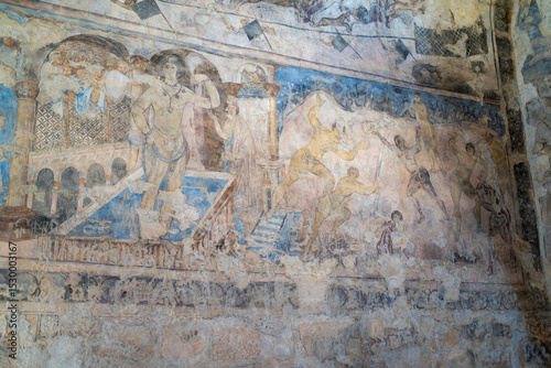 Ancient Wall Painting: Detailed view of an antique wall painting with faded colors, illustrating a historic scene. The artwork showcases cultural heritage and historical storytelling.