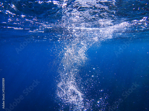 Fototapeta Naklejka Na Ścianę i Meble -  Ocean blue underwater with sunrays, Underwater Sea Deep Water Abstract Sunshine, sea wave , clean waters in summer time, Natural underwater seascape, sand on ocean floor and water surface with sunligh