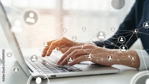 Person typing on a laptop with social network connections overlayed on the hands and keyboard view