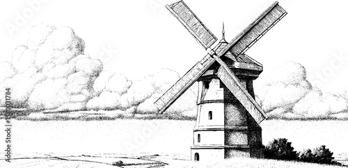 Historic windmill sails turning against cloudy sky in scenic rural landscape