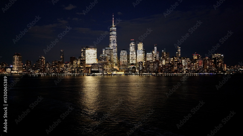 Fototapeta premium Night View Of Downtown New York At Manhattan In New York United States. City At Night Landscape. Illuminated Downtown. Downtown New York At New York United States. Empire State Building. 