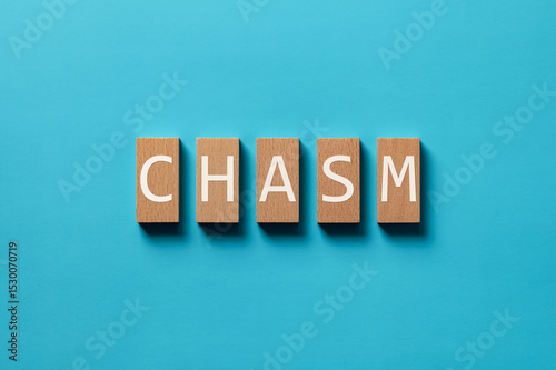 There is wood block with the word CHASM. It is as an eye-catching image.