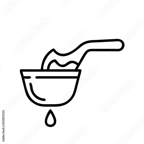 Ladle pouring liquid into bowl with dripping drop