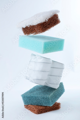 Wallpaper Mural Close-up of floating mattress layers, featuring memory foam, spring coils, and coconut coir. Suspended in mid-air against a white background, showcasing innovative mattress design and comfort. Torontodigital.ca