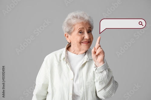 Senior woman pointing at we...