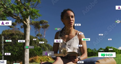Woman reading on hill glancing causing comment bubbles follower badges like icons rising around her