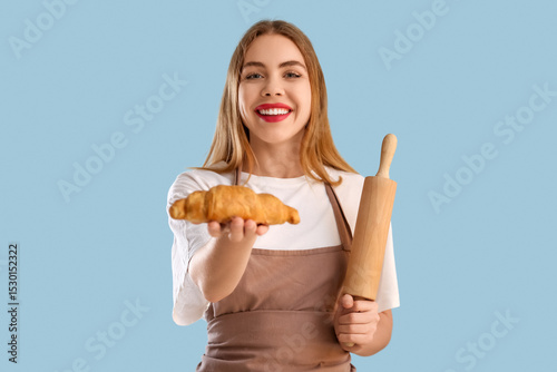 Pretty young woman in apron...