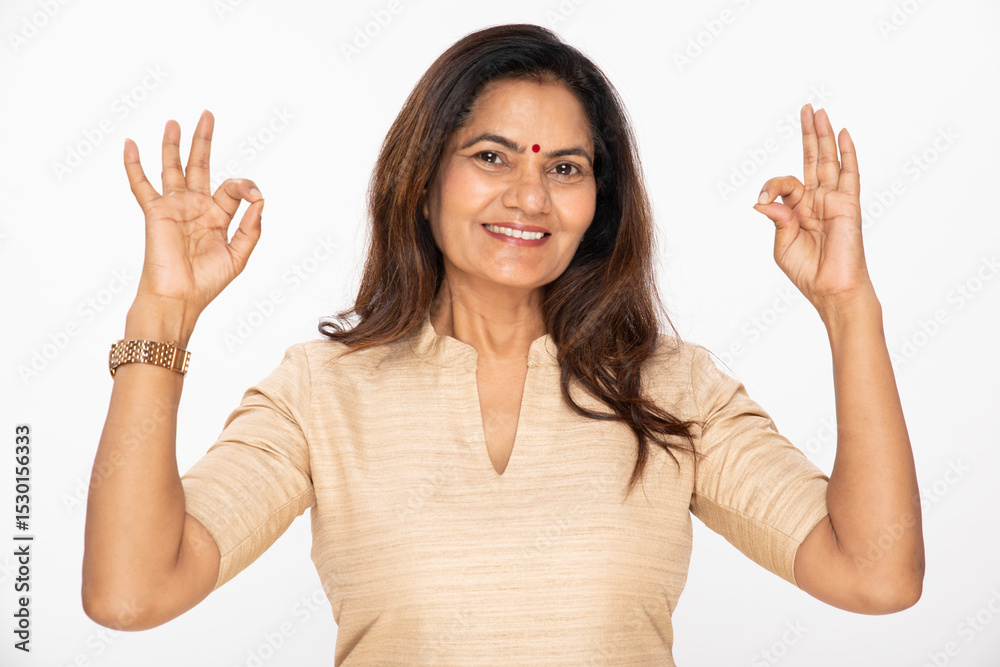 Portrait of an Indian happy woman showing shocking, surprised, wow gesture, open hands and exciting face expressions on white studio background Portrait of an Indian happy woman showing shocking, surprised, wow gesture, open hands and exciting face expressions on white studio background