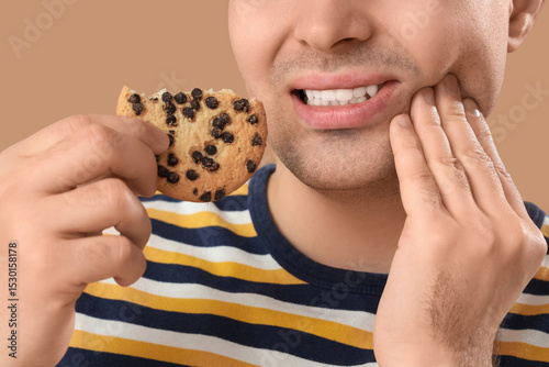 Young man with cookie suffe...
