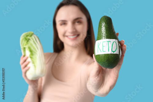Young woman with vegetables...