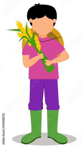 youthful farmer standing with bundles of harvested rice. farmer with harvested rice