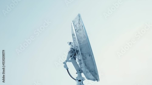 Large White Satellite Dish Against a Clear Pale Blue Sky Telecommunications Technology for Wireless Internet Access Worldwide