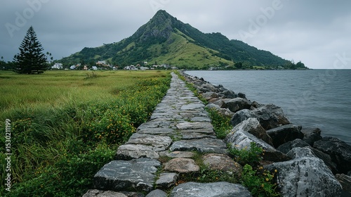A stone pathway leads to a tranquil bay.