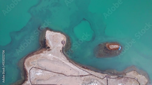 Drone view of Karakul Lake‌ on sunny cloudy day in Tashkurgan County, Kashgar, Southern Xinjiang, China. Aerial landscape of landmark on Pamir plateau, 4k real time footage, travel concept.