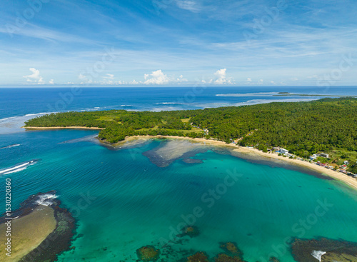 Tropical island and the deep blue sea surrounded. Mindanao, Philippines. Seascape: Summer and travel concept.