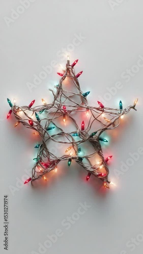 Colorful Christmas Lights Arranged in Star Shape on Plain Background for Holiday Decoration and Celebration