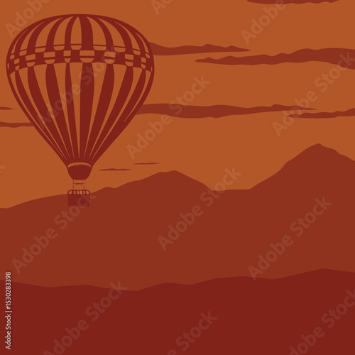 Hot air balloon flying over mountains at sunset scenery