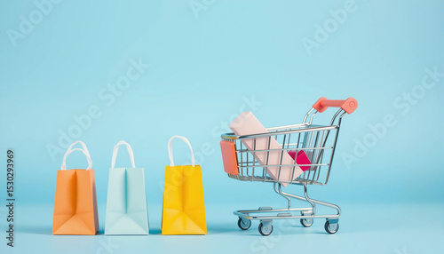 Colorful shopping bags in a cart on a blue background, representing retail and online shopping concepts.