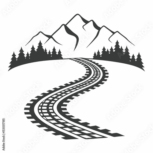 A winding railway track with mountains and trees behind it