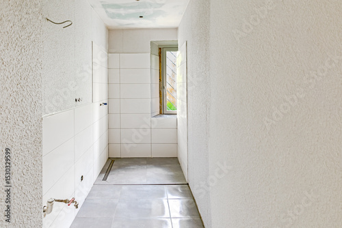 renovated bathroom with window without sanitary objects