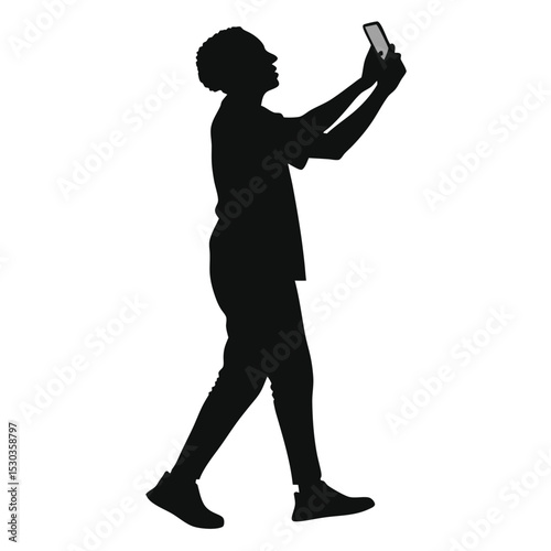 Silhouette of a person using a smartphone to take a photo upwards