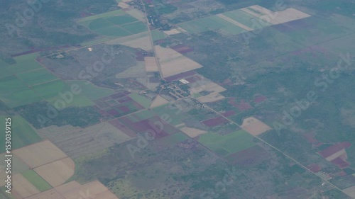 Aerial shot from a commercial airline over Cuba. Over central northern rural farmland areas.