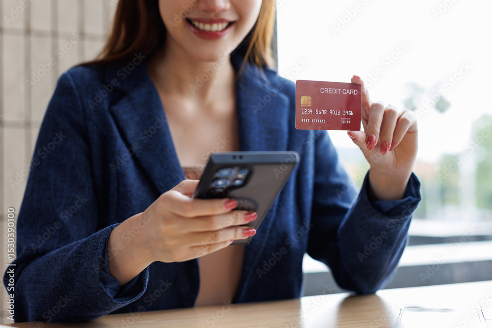 Business woman, hand and credit card for online shopping in payment, e commerce on phone for purchase.asian young woman banking and investing in retail sale for discount, savings for company or projec Business woman, hand and credit card for online shopping in payment, e commerce on phone for purchase.asian young woman banking and investing in retail sale for discount, savings for company or projec