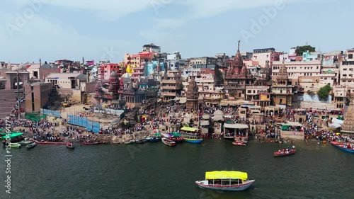Varanasi, Uttar Pradesh, India-25th February 2025- 
Aerial view drone shot of Varanasi ghat area, showing Ganga River widely spread and huge number of row boats flowing through the river.