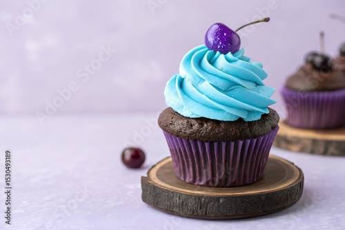  Delicious Blue Frosted Chocolate Cupcake with Cherry