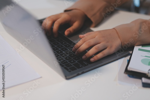Business woman accountant working audit and calculating expense financial annual financial report balance sheet statement, doing finance making notes on paper checking document.