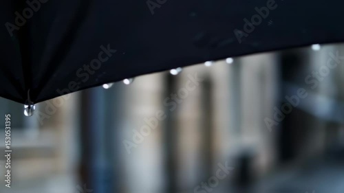 Wallpaper Mural Rainy Day Perspective: Umbrella View on a Wet City Street with buildings in the background Torontodigital.ca