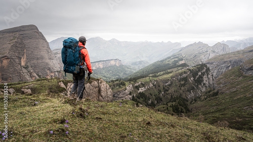 A person hiking in a beautiful and uninhabited valley outdoors
