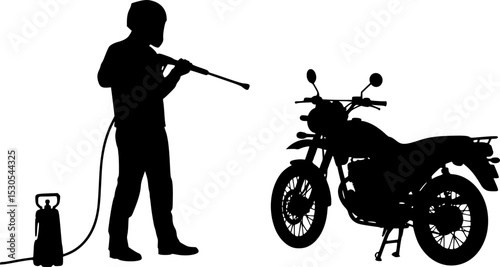 A silhouette of a person cleaning a motorcycle using a pressure washer