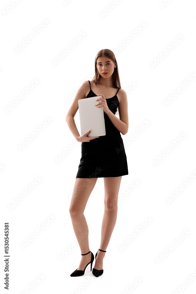 Young woman in black dress poses confidently while holding a white sheet indoors Young woman in black dress poses confidently while holding a white sheet indoors