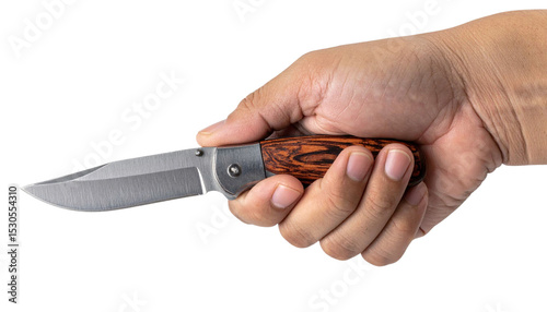 Weathered hand gripping wooden handled pocket knife, poised for use against translucent backdrop photo