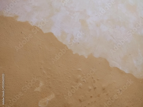 texture, pattern, rough and uneven yellow wall background, creating a lively and abstract background.
