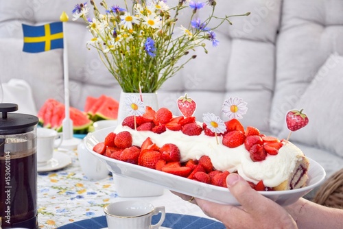 Strawberry cake decorated in honor of midsummer.