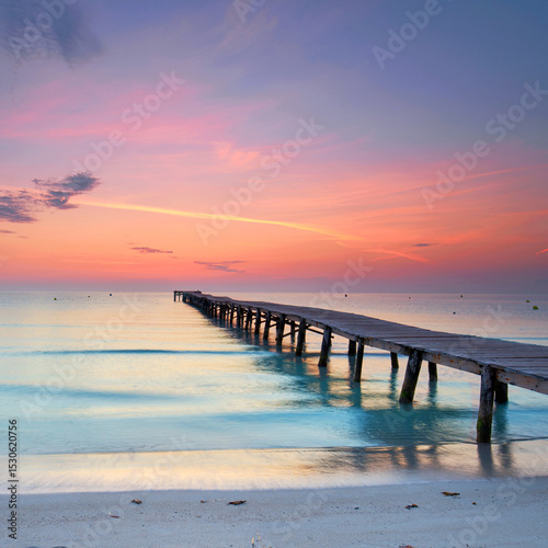 Magnificent Wooden Boardwalk Reaching into the Mediterranean, Bathed in Dazzling Summer Sunrise Hues
