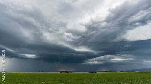 Dramatic panorama of severe storm with gathering dark clouds over Bavarian landscape Germany stormy weather approaching