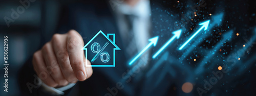 Businessman pointing at glowing house icon with percentage symbol and upward arrows, representing rising real estate interest rates or property market growth. Selective focus.