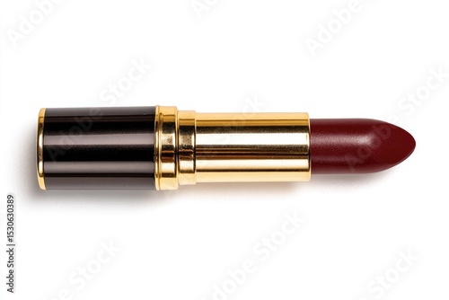 Dark burgundy lipstick, gold casing, isolated