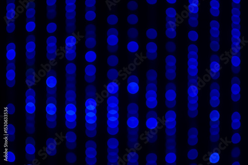 Close up blurred and softy bokeh of blue color from black LED lighting on stage. Background for dramatic or mysterious or Sci-fi concept.