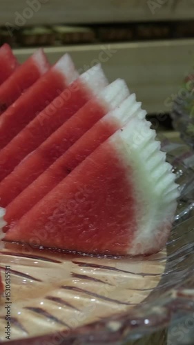 4K stock video of watermelon and watermelon slices on a half white background