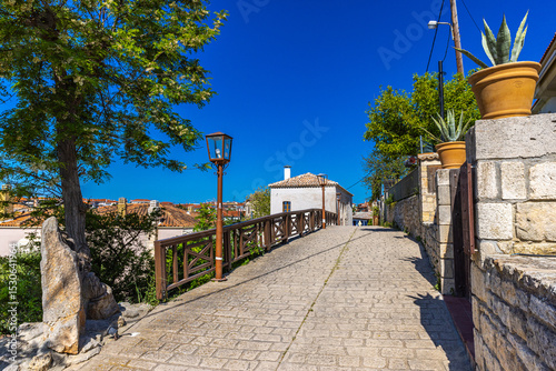 Fototapeta Naklejka Na Ścianę i Meble -  Traditional alley with a view in Afitos