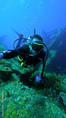 Wallpaper Mural A male scuba diver explores underwater coral reef near USAT Liberty wreck, Bali Torontodigital.ca