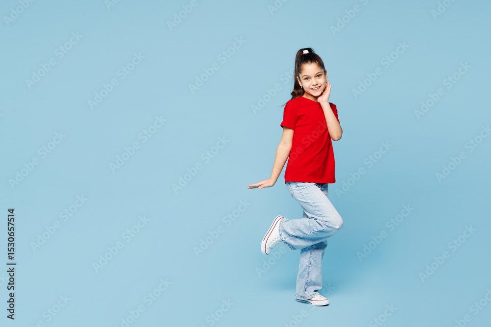 Full body little kid girl 8-9 years old wearing red t-shirt have fun put hand on face raise up leg isolated on blue color background child studio portrait. Mother's Day love family lifestyle concept. Full body little kid girl 8-9 years old wearing red t-shirt have fun put hand on face raise up leg isolated on blue color background child studio portrait. Mother's Day love family lifestyle concept.