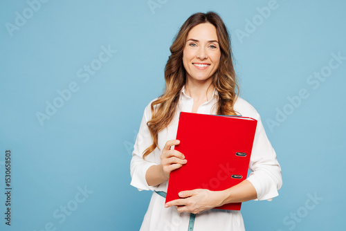 Young employee business woman corporate lawyer she wear shirt classic formal clothes work in office hold red folder for papers document bookkeeping isolated on pastel blue background studio portrait