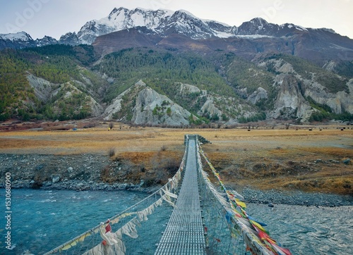 Himalayas, Nepal - The famous hiking on the roof of the world called Annapurna Circuit in Himalaya range mountain, with little village, buddhist stupa and mountains of 8000 meters.