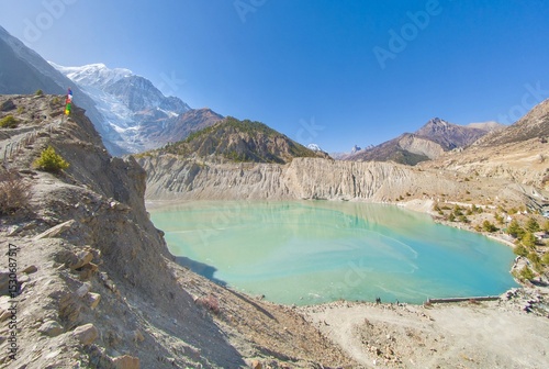 Himalayas, Nepal - The famous hiking on the roof of the world called Annapurna Circuit in Himalaya range mountain, with little village, buddhist stupa and mountains of 8000 meters.