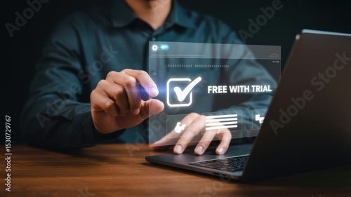 Person interacting with a holographic interface displaying a free trial offer.